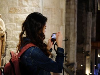 Portrait of woman photographing