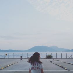 Rear view of woman in parking lot