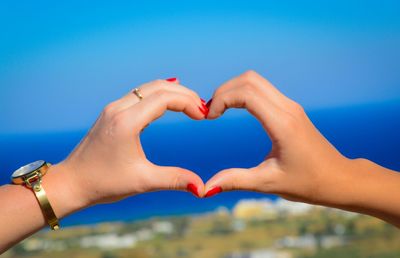 Cropped image of woman holding hands