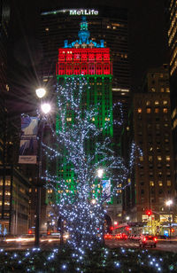 Illuminated christmas tree at night