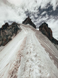 Dramatic shot of ridge line towards aiguille du midi under clouds