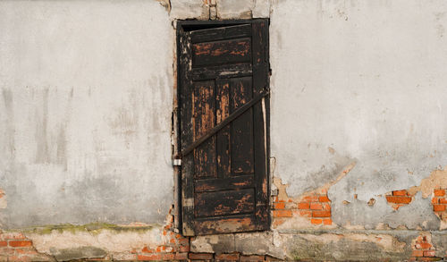 Close-up of abandoned door