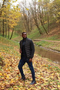 Full length of man in forest during autumn