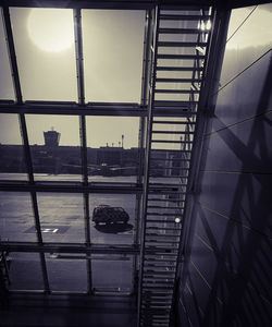 High angle view of modern glass building against sky