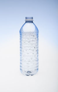 Close-up of water bottle against white background