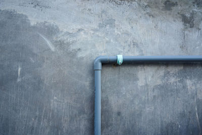 Close-up of pipe on wall