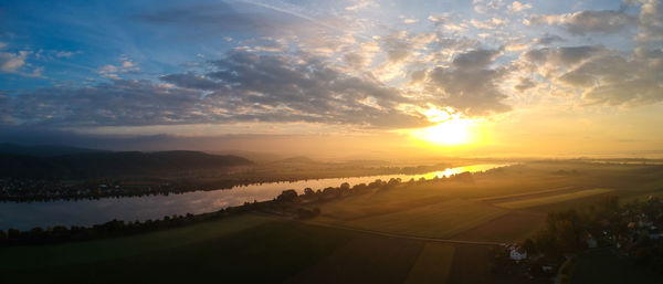 Scenic view of landscape against sky during sunset