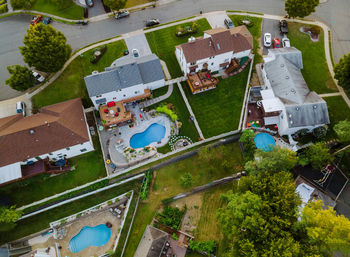 High angle view of swimming pool by building in city