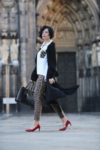 Fashionable woman walking in city