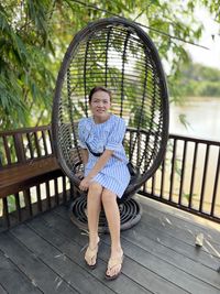 Portrait of young woman sitting on staircase