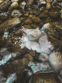 High angle view of stones in sea