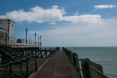 Pier over sea against sky