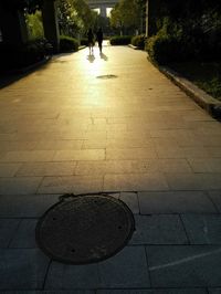 Woman walking on footpath