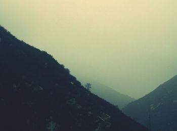 Scenic view of mountains against sky at sunset