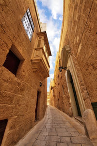 Low angle view of old building against sky