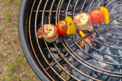 High angle view of meat on barbecue grill