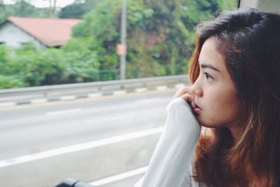 Woman looking out window