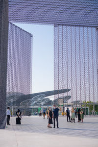 Group of people walking in modern building