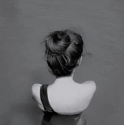 High angle view of woman standing against wall