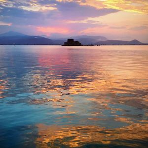 Scenic view of sea at sunset