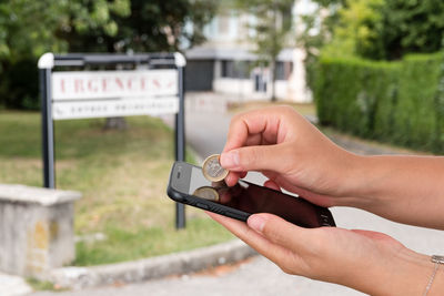 Close-up of person holding mobile phone