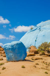 Scenic view of painted rocks against blue sky, tafraout, morocco