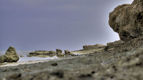 Close-up of rock formation against clear sky
