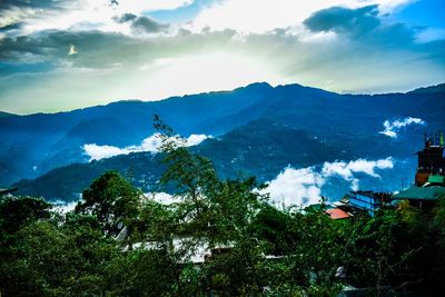 High angle view of trees and mountains against sky