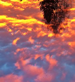 Low angle view of cloudy sky at sunset