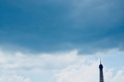 Low angle view of building against cloudy sky