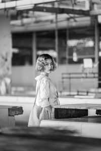 Full length of boy standing against wall