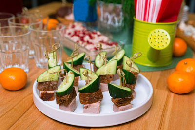 Canapés of fresh cucumber rye bread and ham