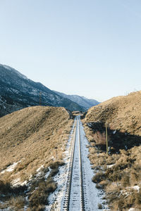 High angle view of railroad tracks against clear sky