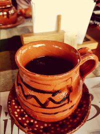 Close-up of coffee served on table