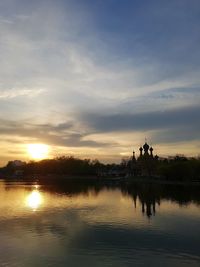 Scenic view of lake against sky during sunset