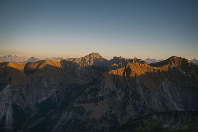 Scenic view of snowcapped mountains against clear sky