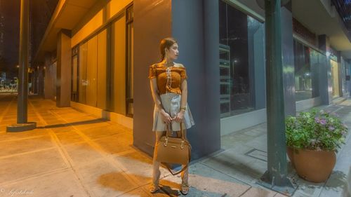 Woman standing outside building