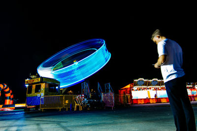 View of illuminated people at night