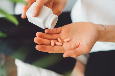 Midsection of doctor giving medicine