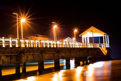 Illuminated street light at night