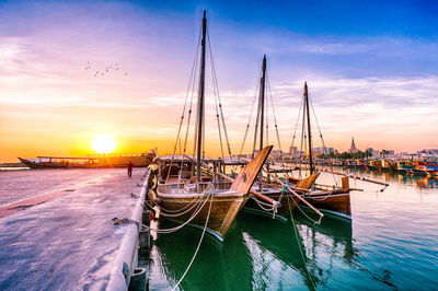 Boats moored at harbor