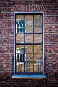 Close-up of window on brick wall