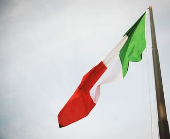 Low angle view of italian flag against sky