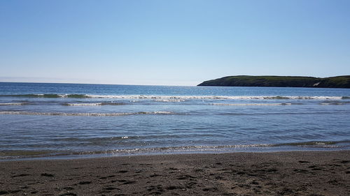 Scenic view of sea against clear sky