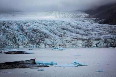 Scenic view of frozen lake against sky