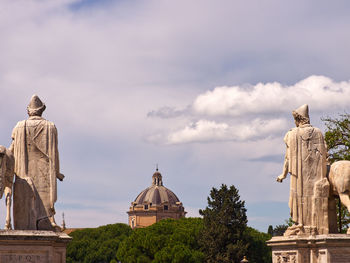 Low angle view of statue against sky