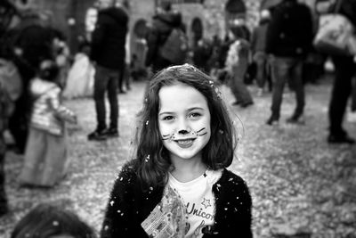 Portrait of smiling girl standing outdoors