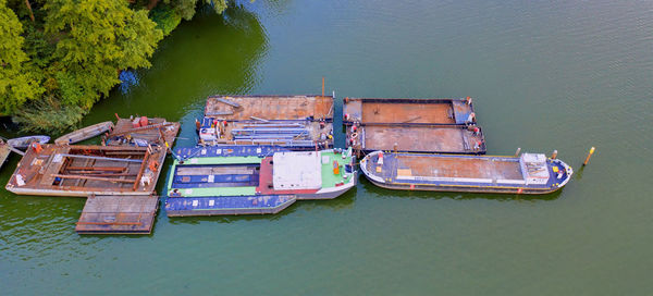 Aerial view of boats moored on river