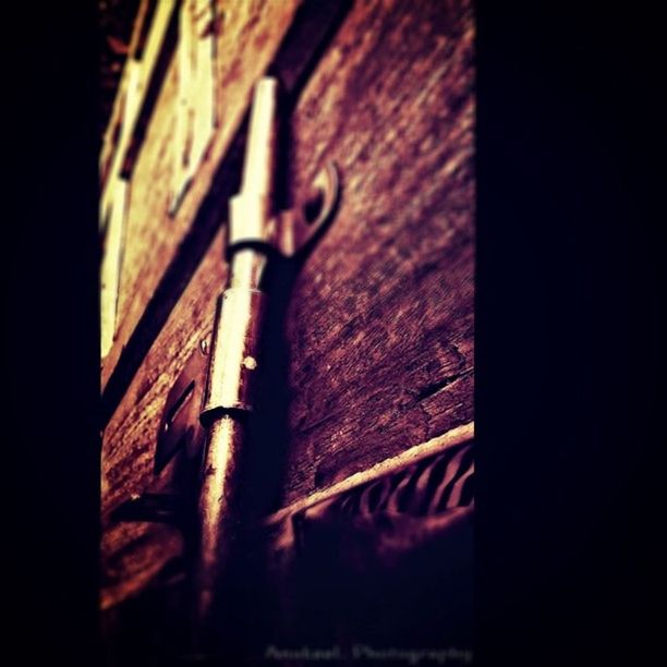 built structure, architecture, wood - material, close-up, old, wooden, selective focus, protection, wall - building feature, building exterior, security, safety, night, low angle view, weathered, no people, wall, focus on foreground, metal, wood
