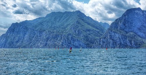 Panoramic view of garda lake from torbolle direction with sailing regatta.